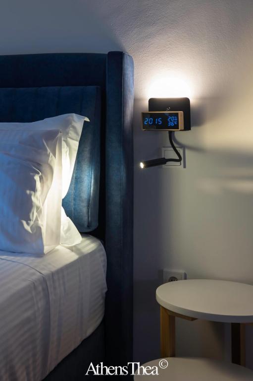A bed or beds in a room at AthensThea Beta Luxury Penthouse Apt in Omonia