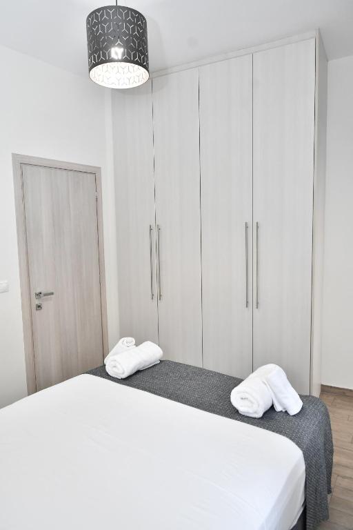 Кровать или кровати в номере Michaela's guesthouse