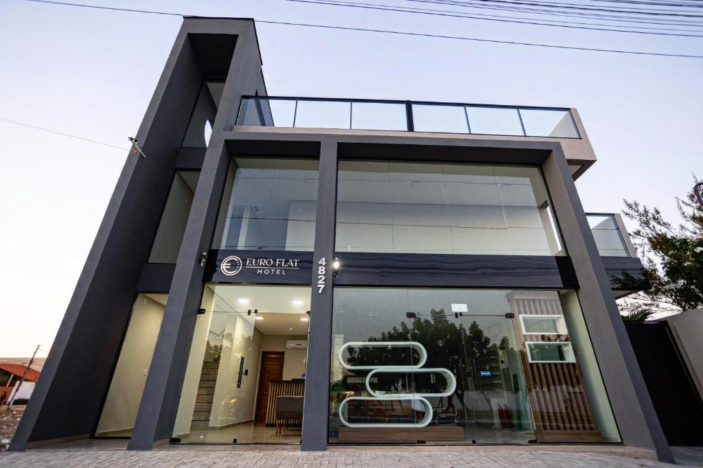 a store front of a building with glass doors at Euro Flat Hotel in Parnaíba