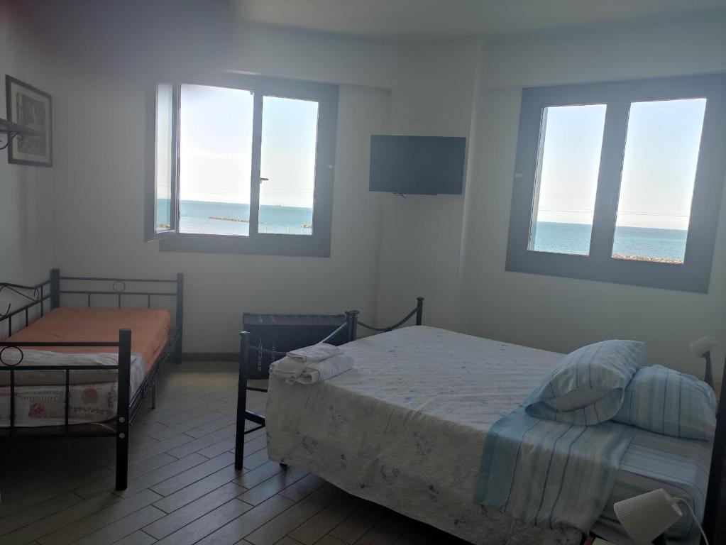 Postel nebo postele na pokoji v ubytování B&B Pontemare