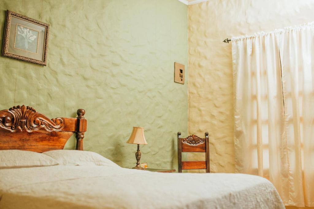 Postel nebo postele na pokoji v ubytování Hotel Condesa