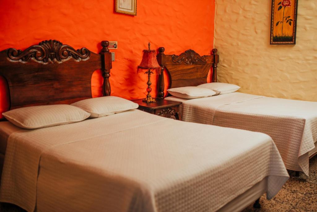 Postel nebo postele na pokoji v ubytování Hotel Condesa