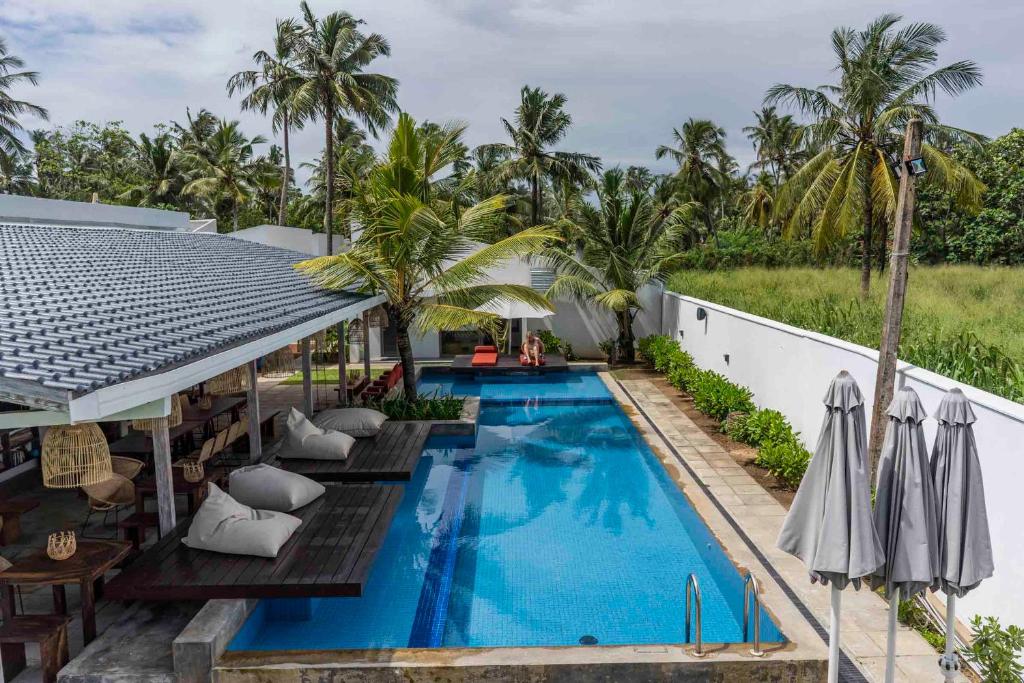an image of a swimming pool at a resort at Global Surf Lodge Kabalana in Ahangama