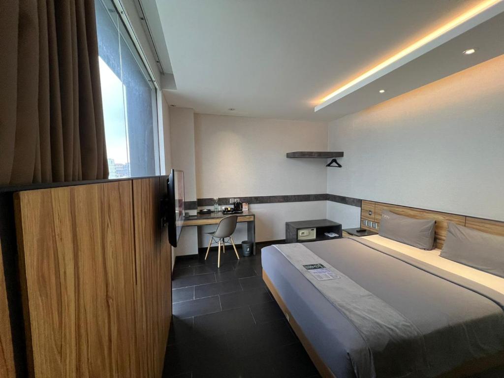 Postel nebo postele na pokoji v ubytování Erian Hotel