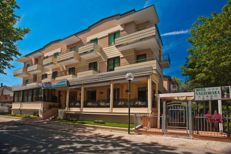 a building on the corner of a street at Hotel Vallechiara in Cesenatico