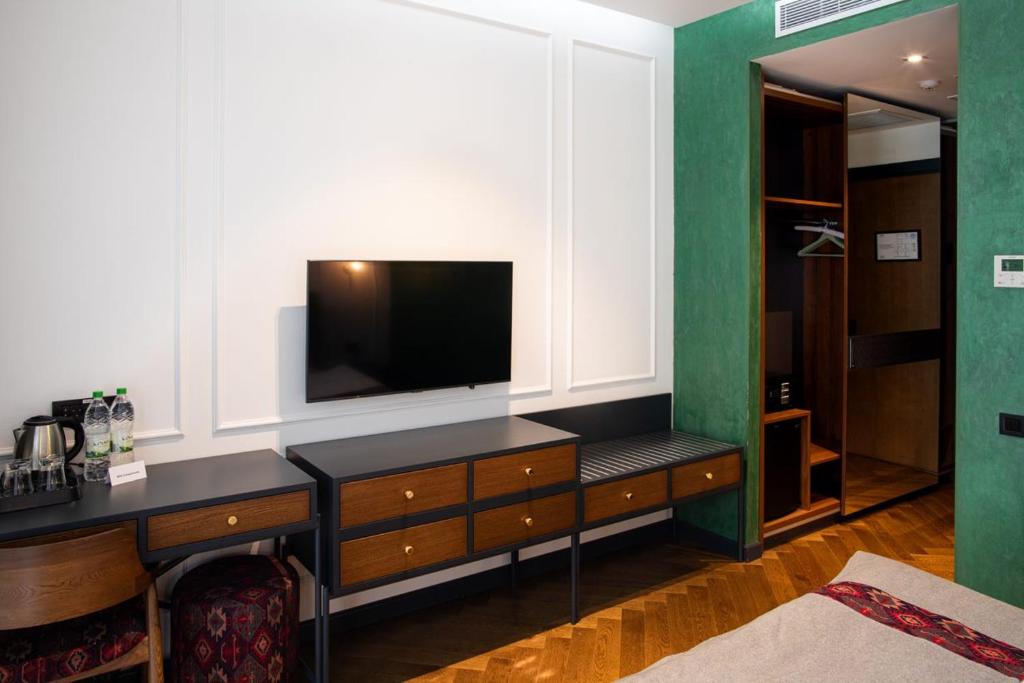 TV a/nebo společenská místnost v ubytování Molokan Inn Hotel