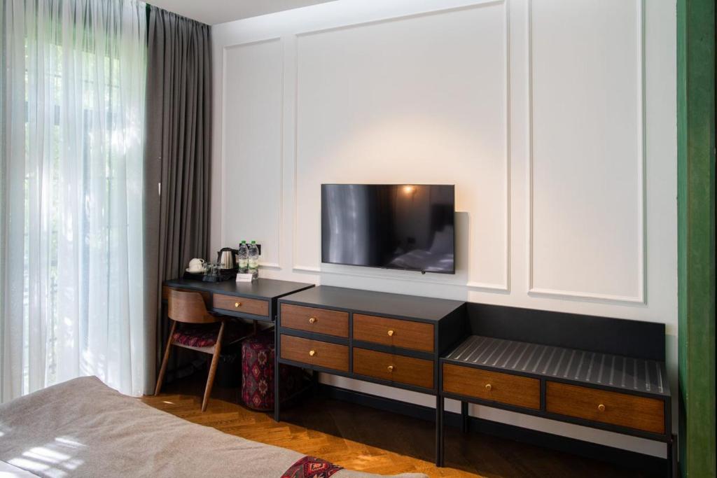 TV a/nebo společenská místnost v ubytování Molokan Inn Hotel