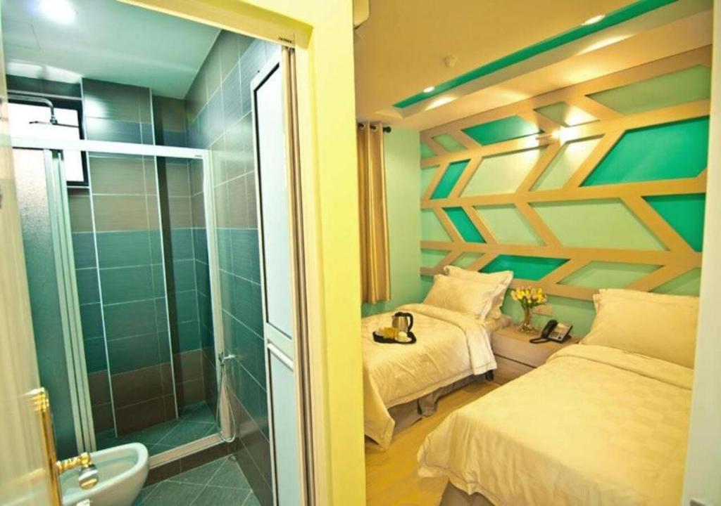Postel nebo postele na pokoji v ubytování Sunshine Inn