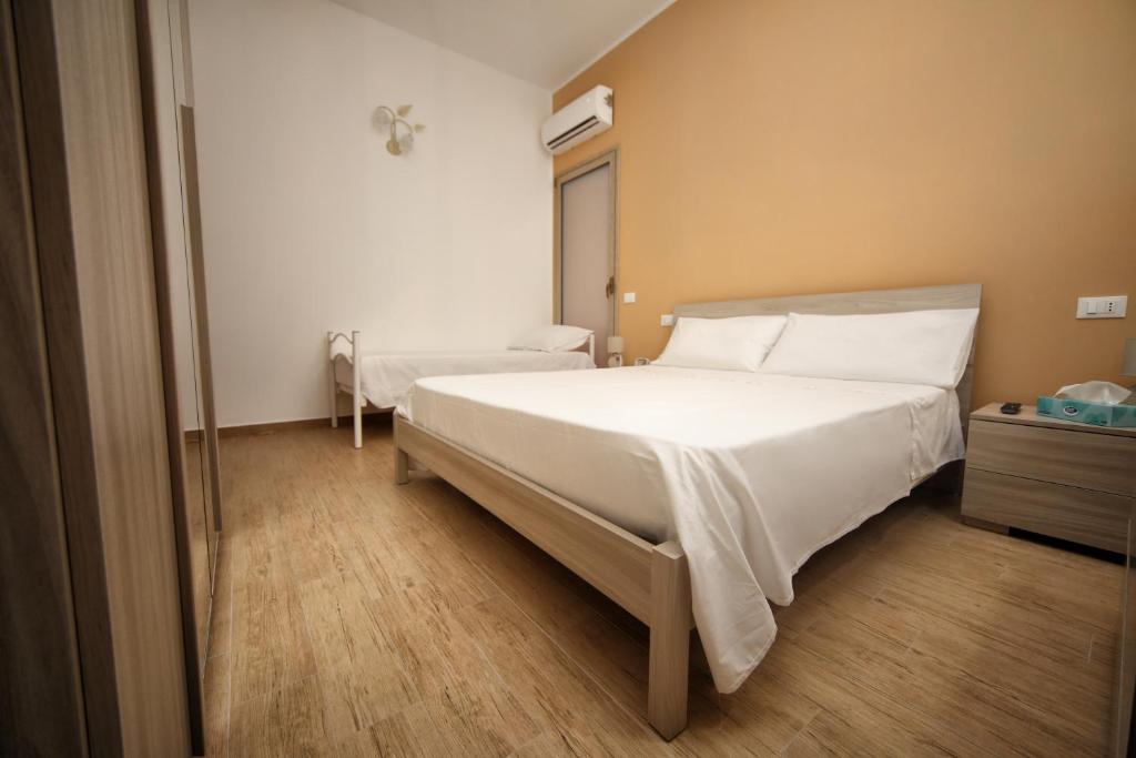 Posteľ alebo postele v izbe v ubytovaní B&B Bouganville