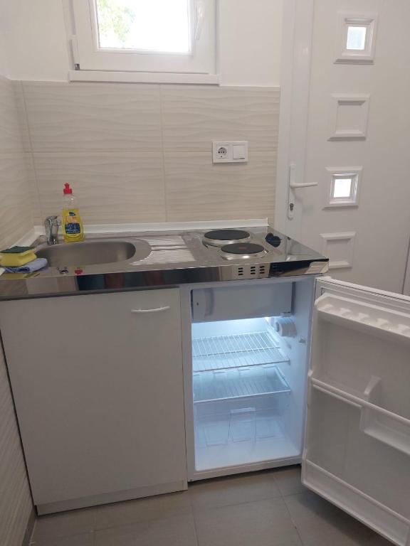 Kuchyňa alebo kuchynka v ubytovaní Szépasszonyvölgy Apartman