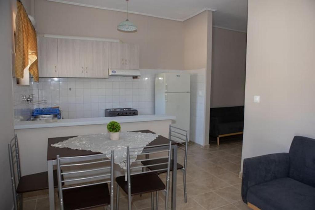 A kitchen or kitchenette at Vasileiou Apartments