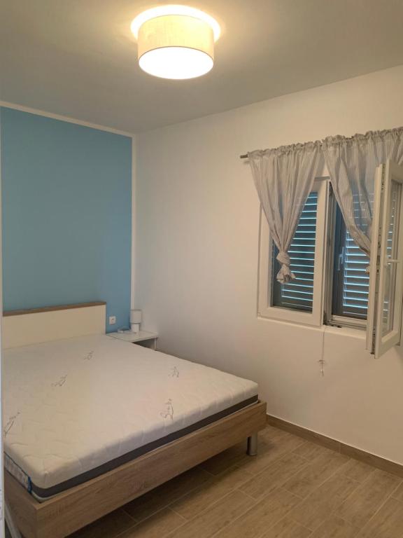 Postel nebo postele na pokoji v ubytování Apartman Magica
