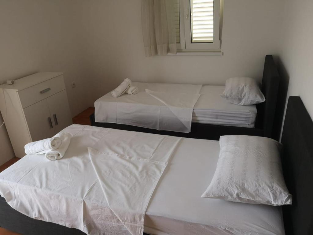 Postel nebo postele na pokoji v ubytování Apartman Magica