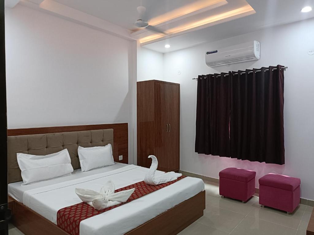 Tempat tidur dalam kamar di Hotel Sunrise Palace