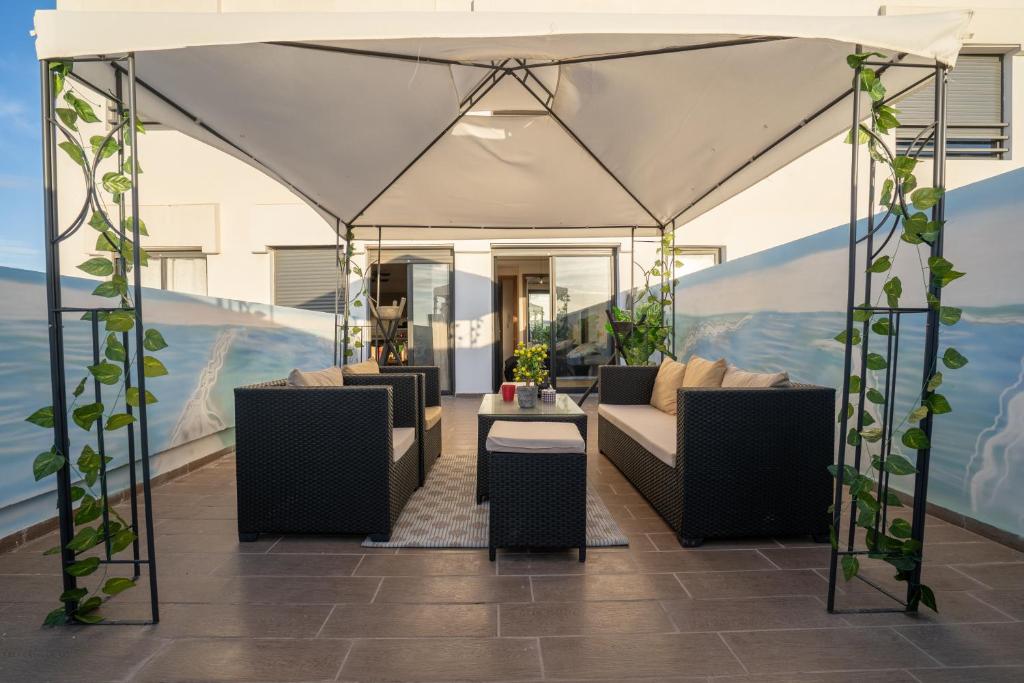 a gazebo with couches and a table at Le Vintage Dead Sea avec Piscine & Rooftop in Casablanca