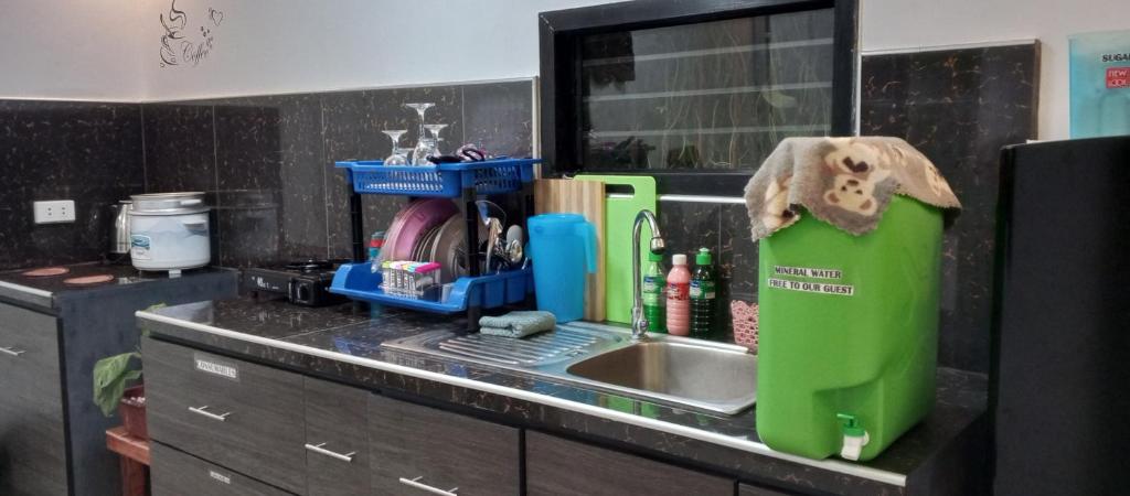 a kitchen counter top with a sink and a counter top at Budget Home in Iloilo Staycation At 8 Pax in Oton