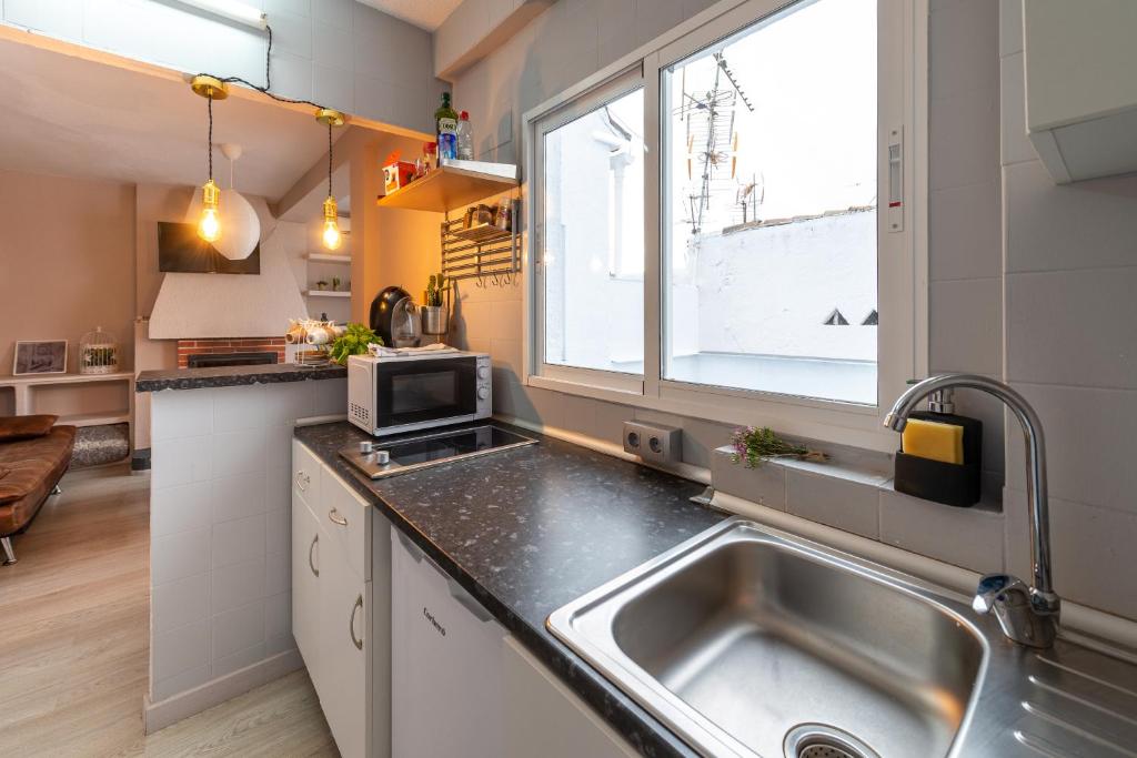 Kuchyň nebo kuchyňský kout v ubytování Precioso apartamento en Granada