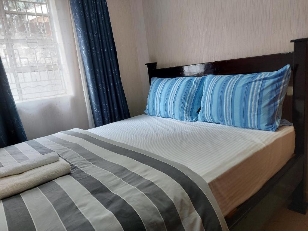 Postel nebo postele na pokoji v ubytování Parkview apartments