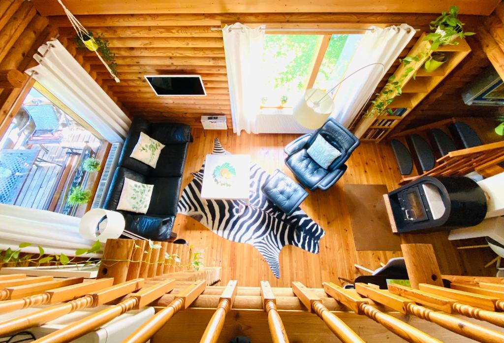 a group of chairs in a room with wooden walls at Eifel-Lounge BLOCKHAUS mit Kamin Garten Balkon nahe Köln Therme Brühl Phantasialand in Weilerswist