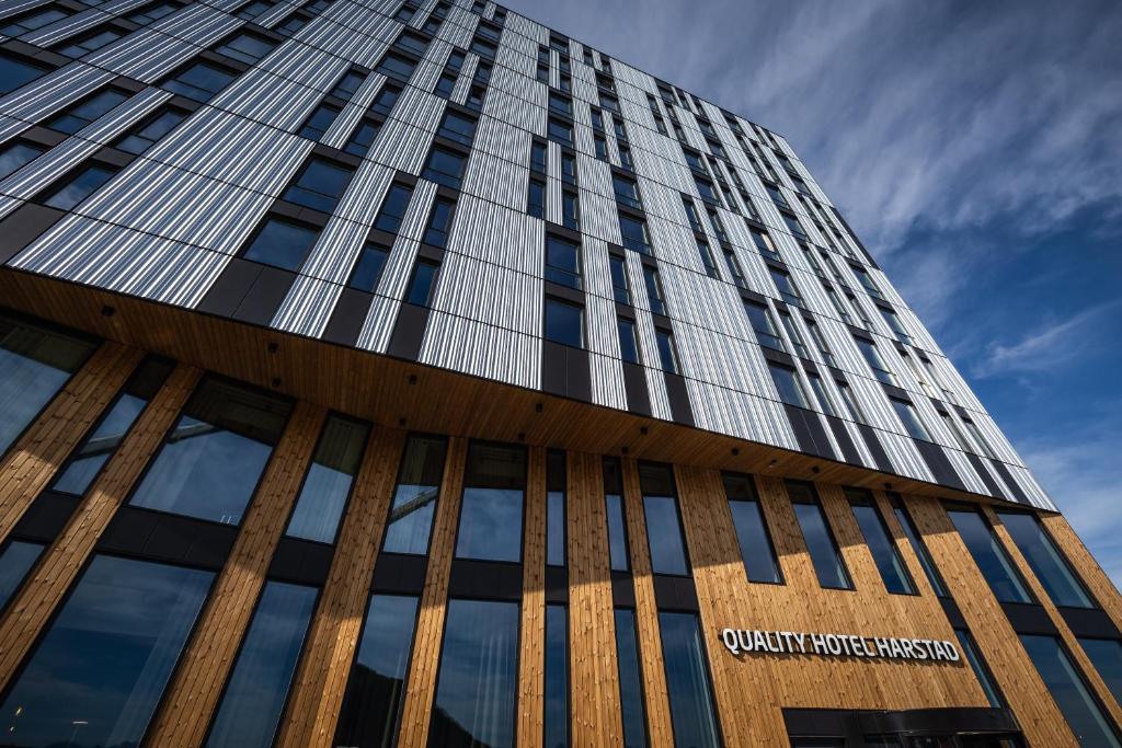 a tall building with a sign on it at Quality Hotel Harstad in Harstad