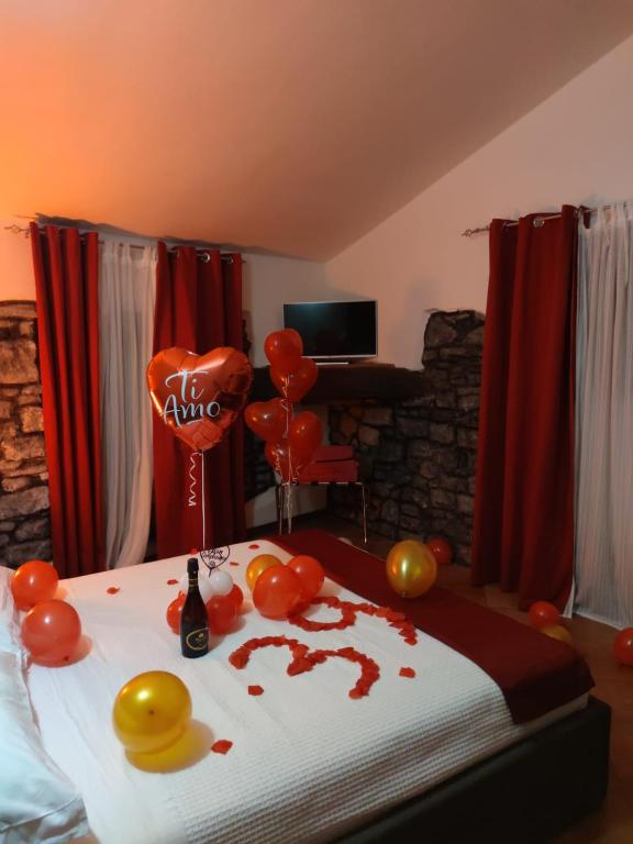 Televízia a/alebo spoločenská miestnosť v ubytovaní Le Undici Rose Hotel