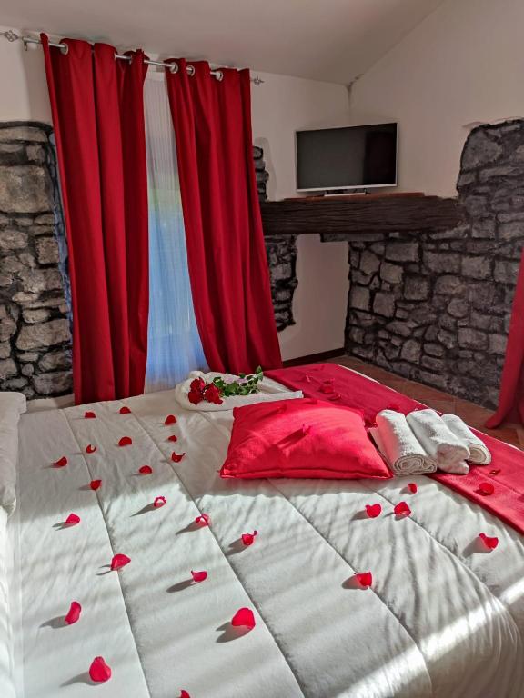 Posteľ alebo postele v izbe v ubytovaní Le Undici Rose Hotel