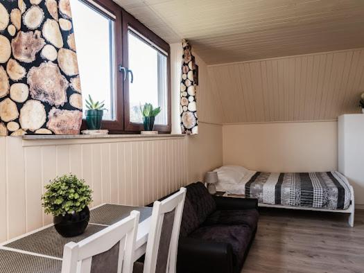 Posteľ alebo postele v izbe v ubytovaní Apartamenty na wzgórzu