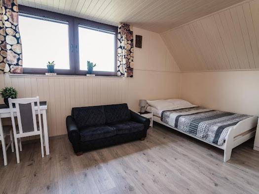 Posteľ alebo postele v izbe v ubytovaní Apartamenty na wzgórzu