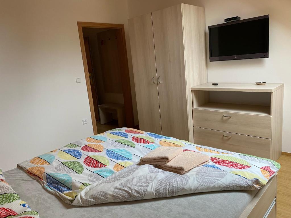 Postel nebo postele na pokoji v ubytování Penzion Ovčárna