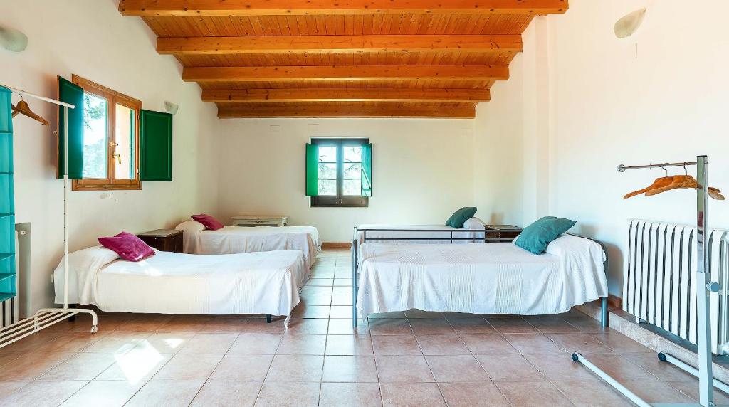 Posteľ alebo postele v izbe v ubytovaní Casa Can Roura