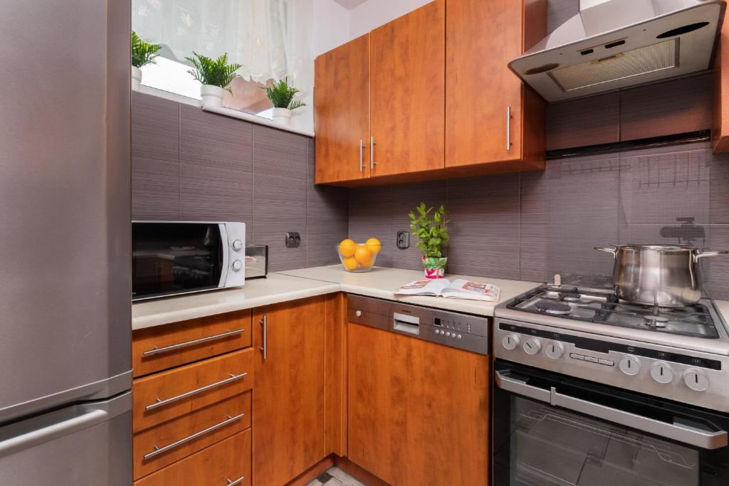 Kuchyňa alebo kuchynka v ubytovaní Seaview Apartment Gdańsk Przymorze by Noclegi Renters