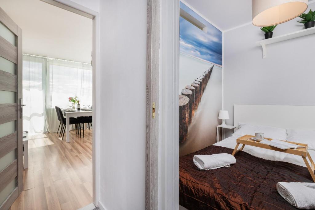 Posteľ alebo postele v izbe v ubytovaní Seaview Apartment Gdańsk Przymorze by Noclegi Renters