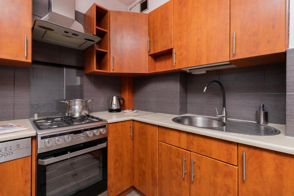 Kuchyňa alebo kuchynka v ubytovaní Seaview Apartment Gdańsk Przymorze by Noclegi Renters