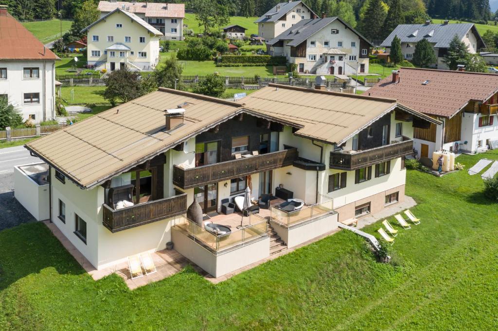 an aerial view of a house with a roof at T3 Pension Wald am Arlberg in Wald am Arlberg