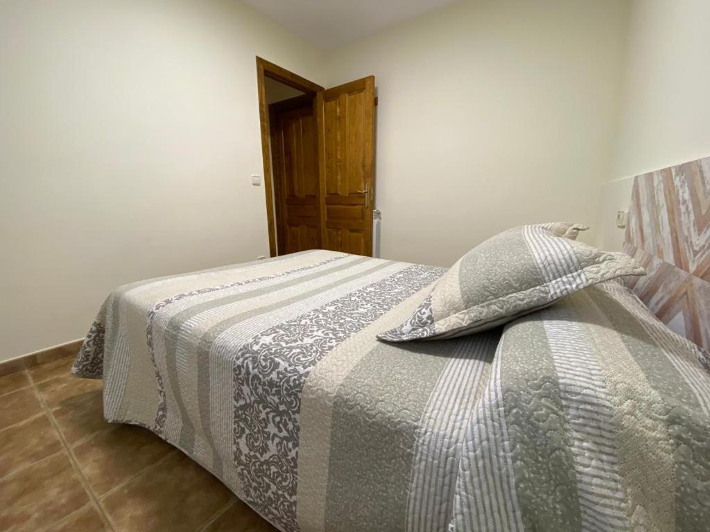 Postel nebo postele na pokoji v ubytování CASA SUERTES-FISCAL
