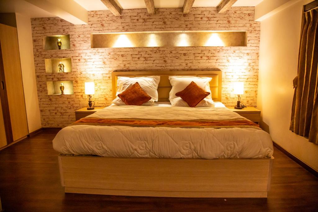 Postel nebo postele na pokoji v ubytování Hotel Traditional