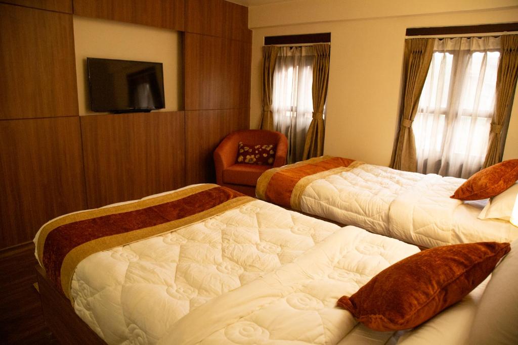 Postel nebo postele na pokoji v ubytování Hotel Traditional