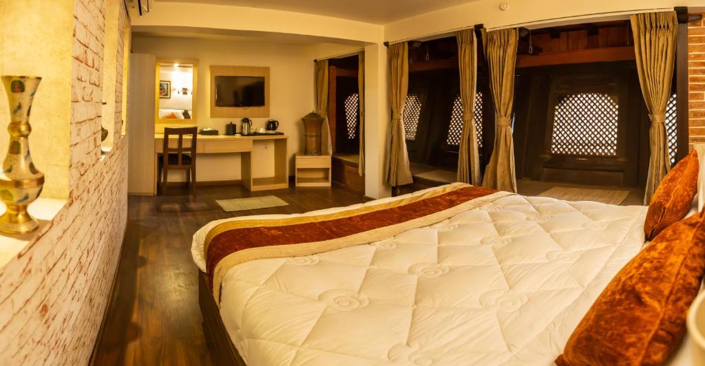Postel nebo postele na pokoji v ubytování Hotel Traditional