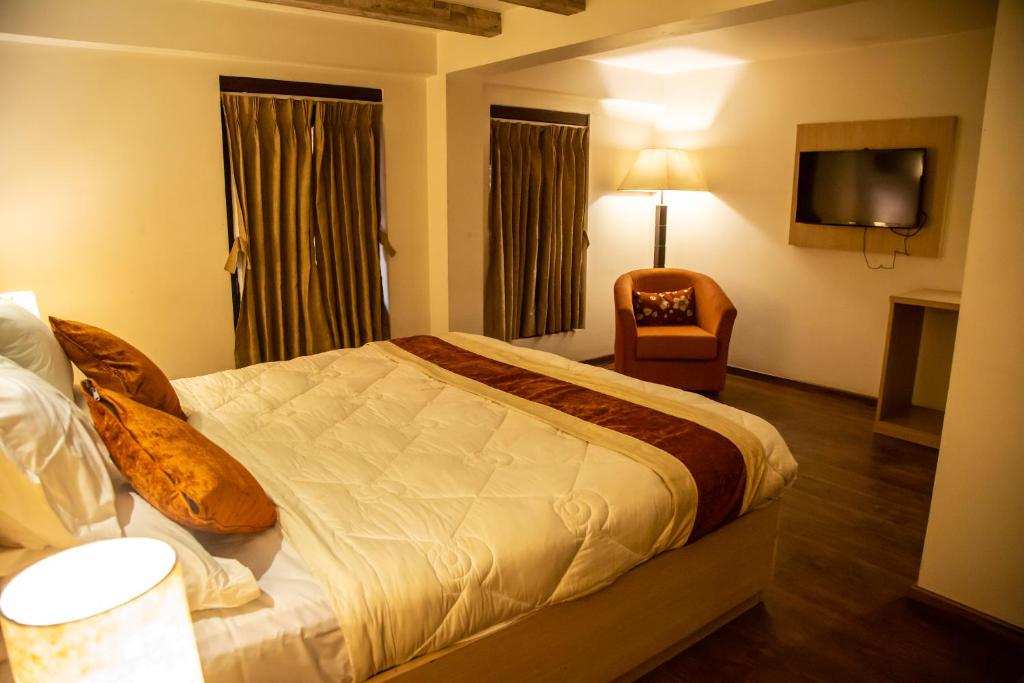 Postel nebo postele na pokoji v ubytování Hotel Traditional