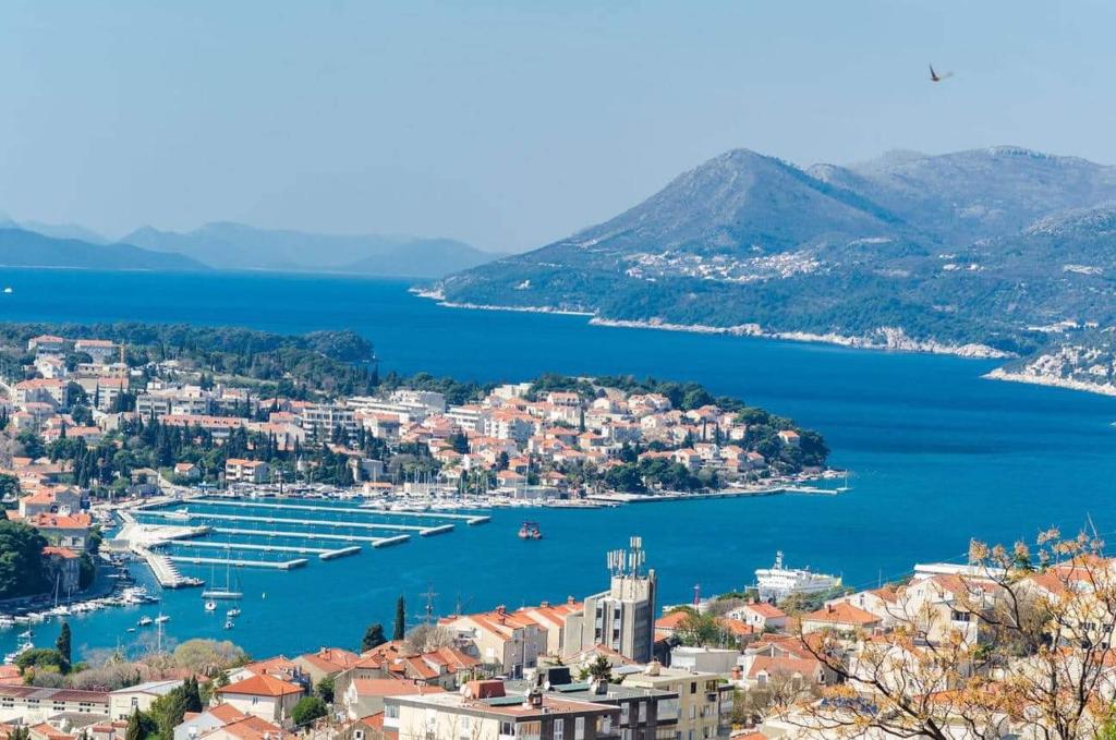 a view of a city and a harbor at Sunny rooms in Dubrovnik