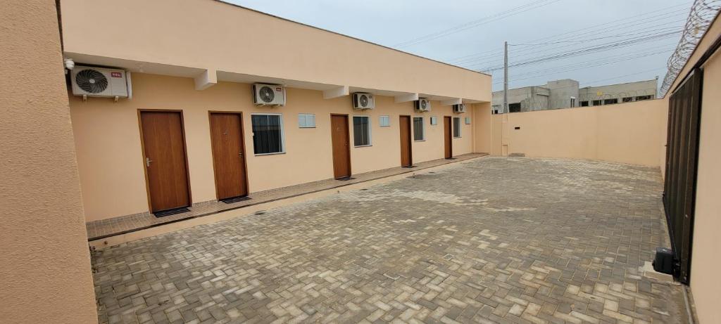 a row of doors on a building at Suítes Guriri in Guriri