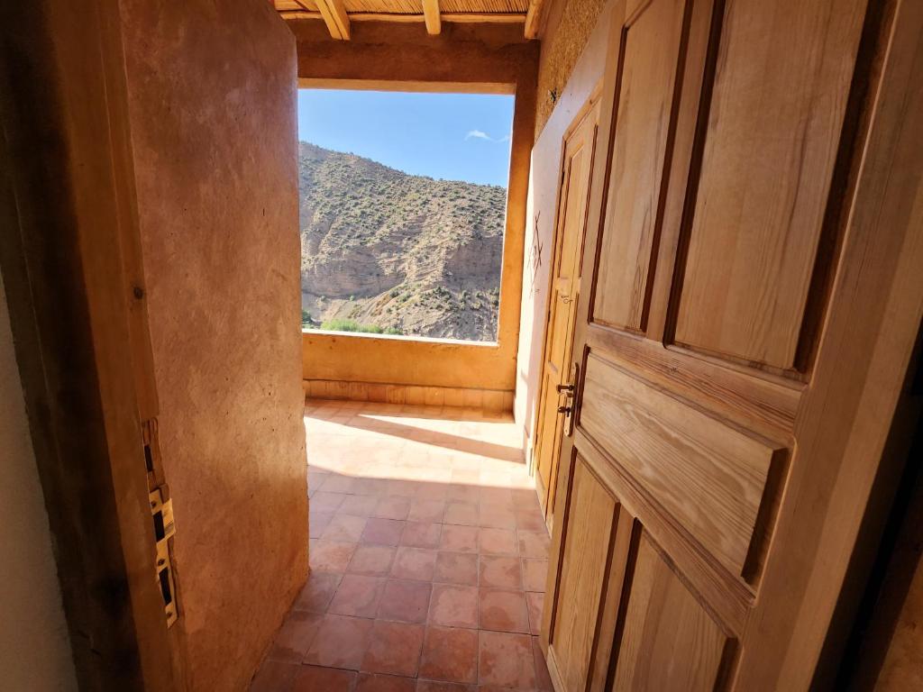 an open door with a view of a mountain at AdaZen Ecolodge in Azilal
