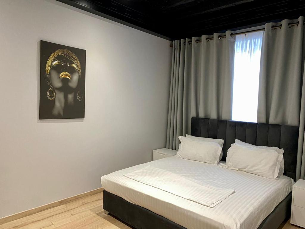 Uma cama ou camas num quarto em Primo Hotel