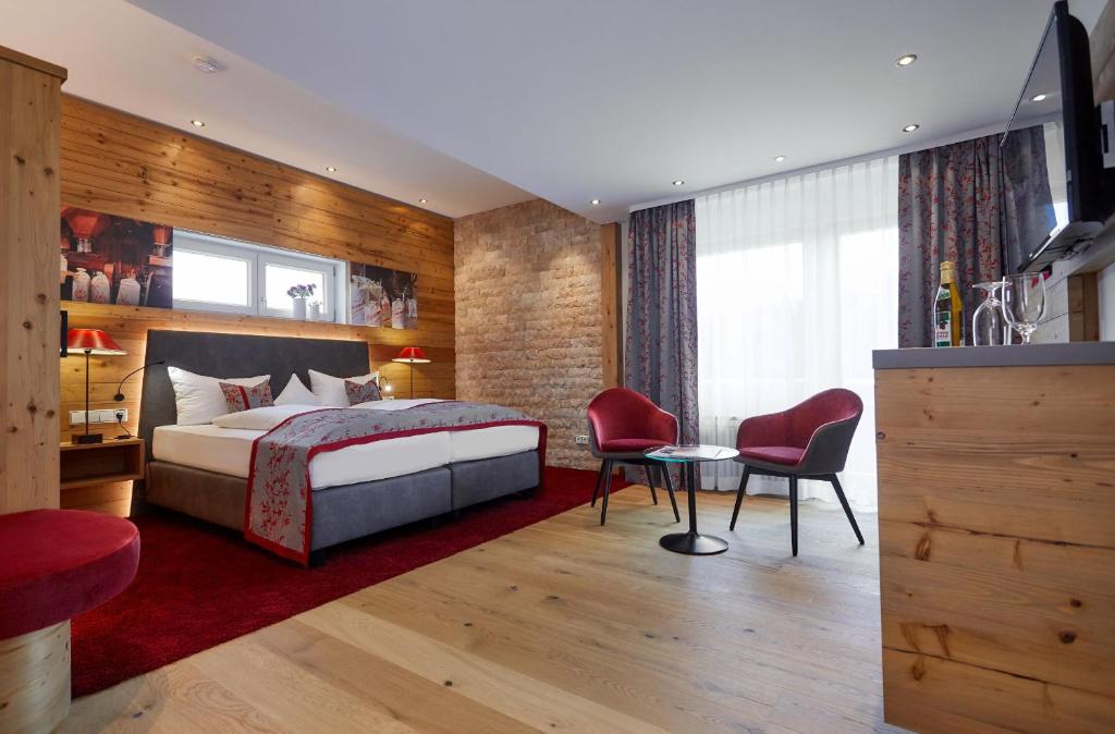 Postel nebo postele na pokoji v ubytování Romantik Hotel Rindenmühle