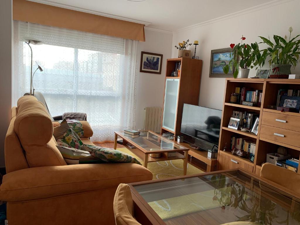 a living room with a couch and a coffee table at Apartamento Conchita in Vigo