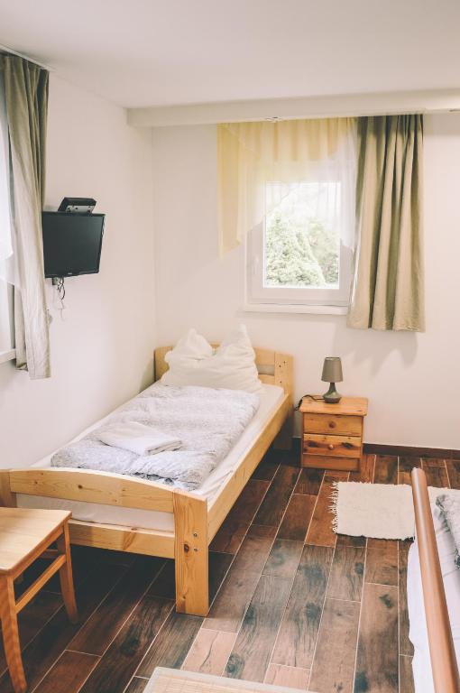 Postel nebo postele na pokoji v ubytování Pension s'Platzl Stuhleck