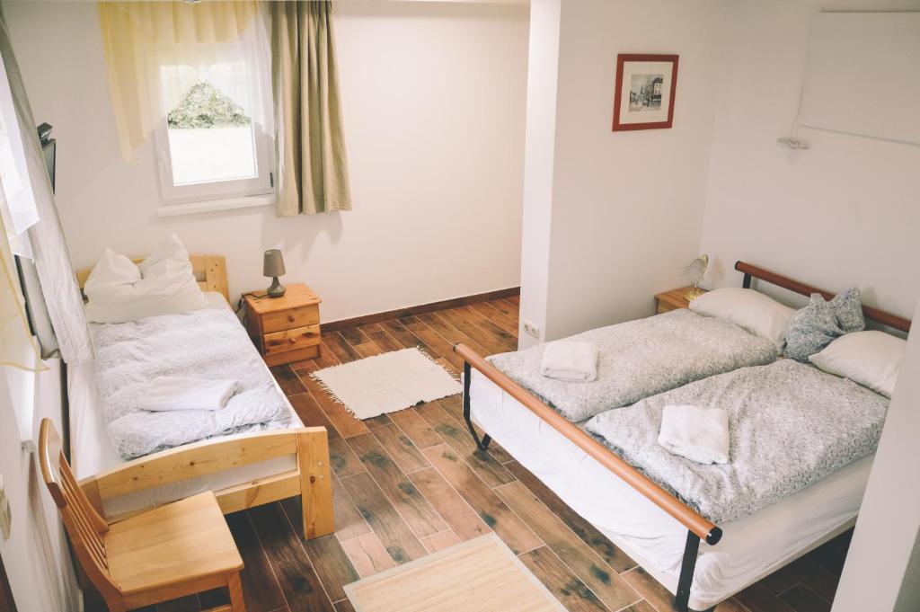 Postel nebo postele na pokoji v ubytování Pension s'Platzl Stuhleck