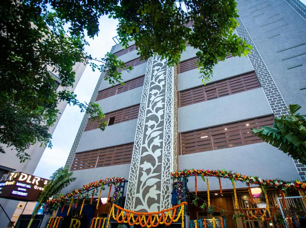 a building with a christmas display in front of it at DLR GRAND in Tirupati