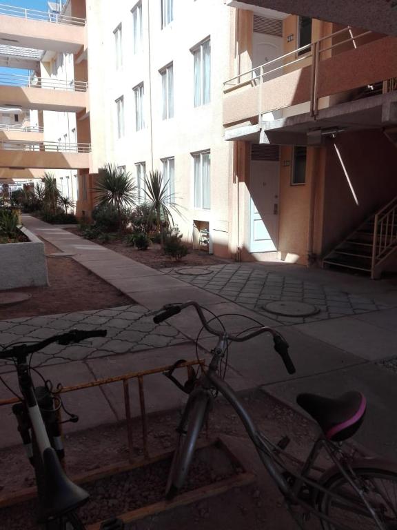 a bike parked in front of a building at Galicia in La Serena