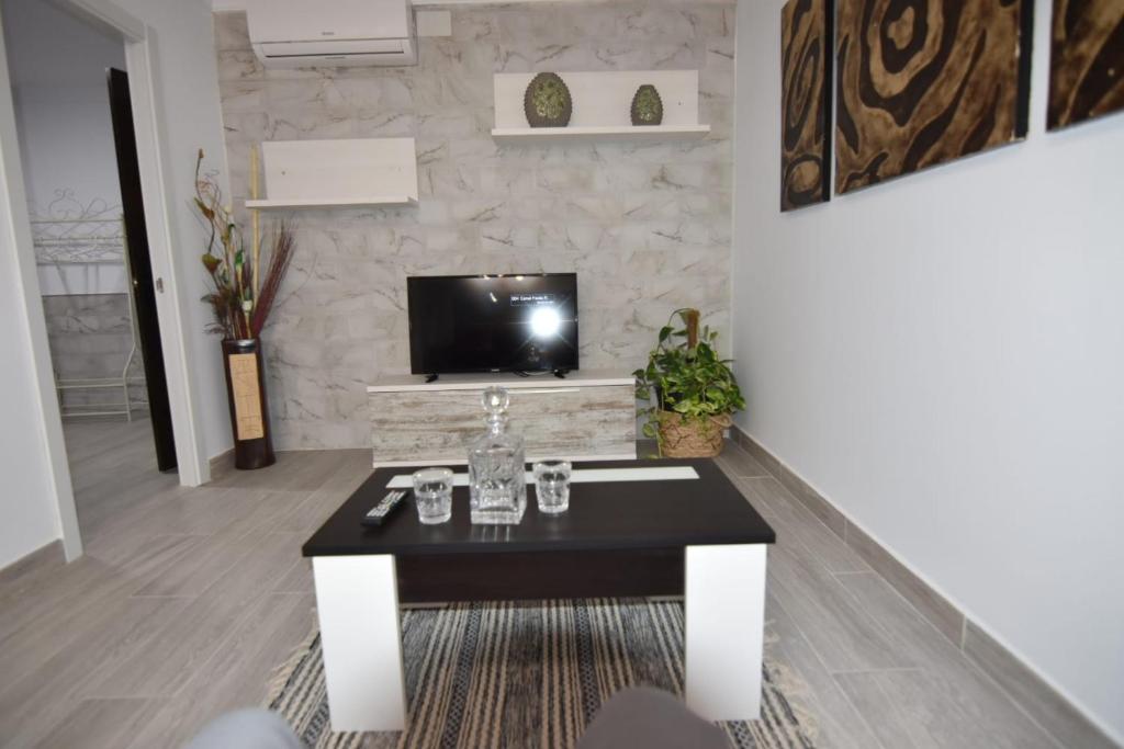 Televízia a/alebo spoločenská miestnosť v ubytovaní Apartamento Daniela 1